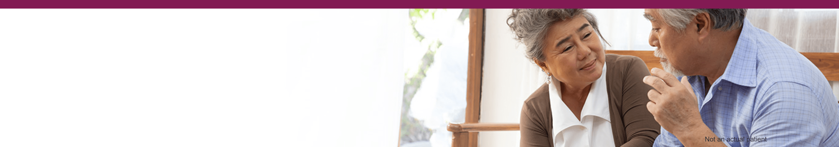 two people sitting and holding hands